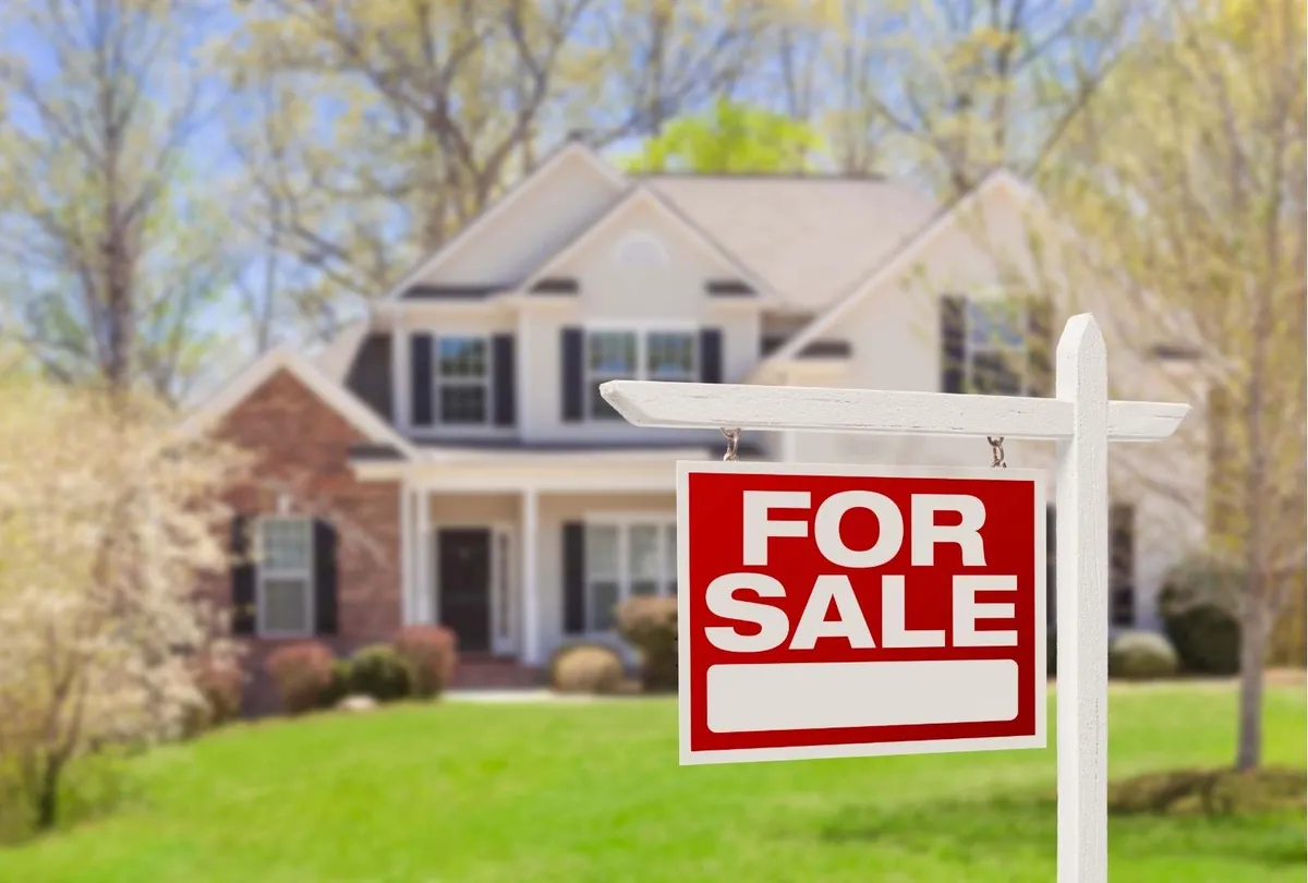 Home for Sale Real Estate Sign and House